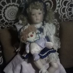 Annabelle type porcelain doll w/clown music box